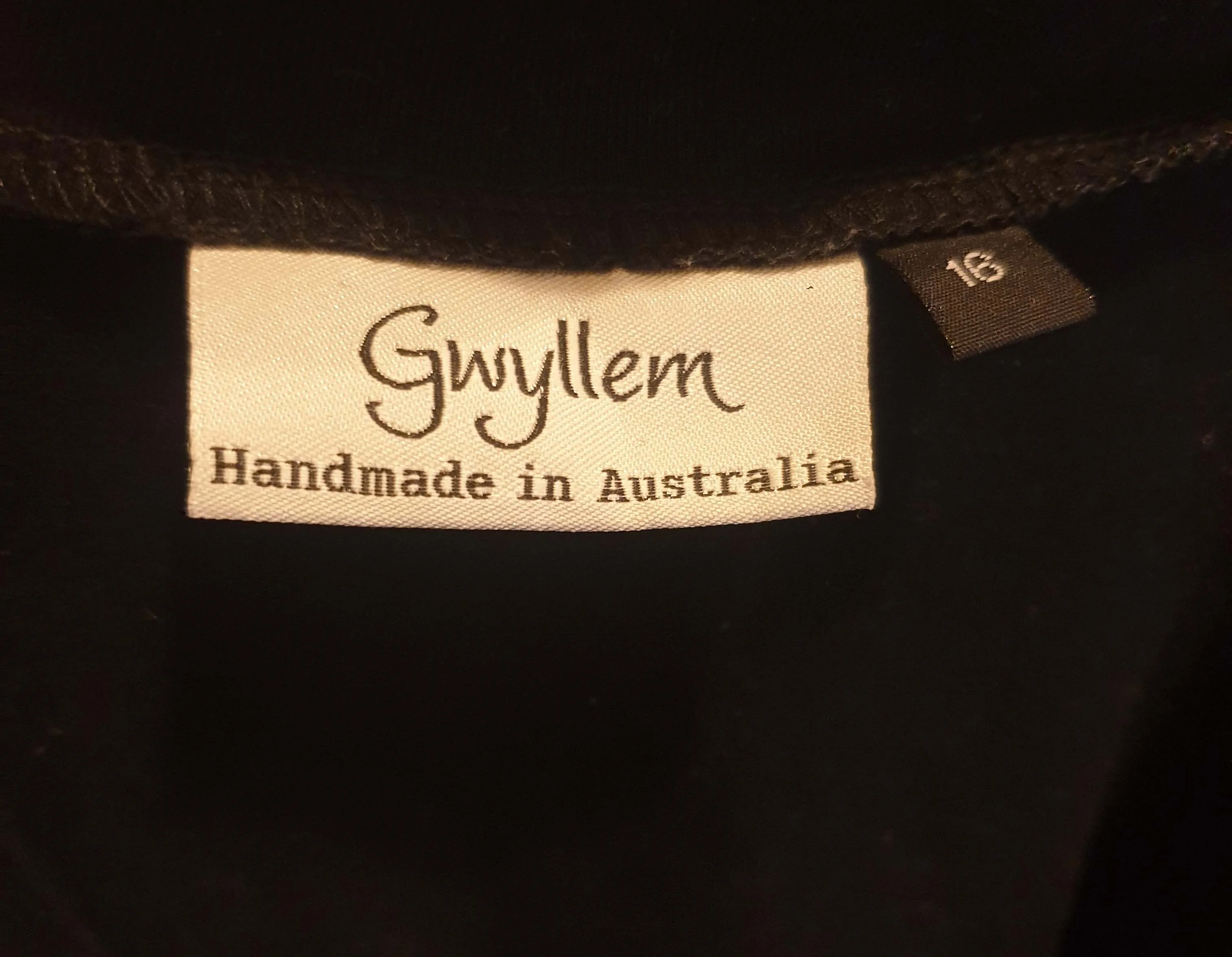 Gwyllem black wrap style top with cute side buttons side 16