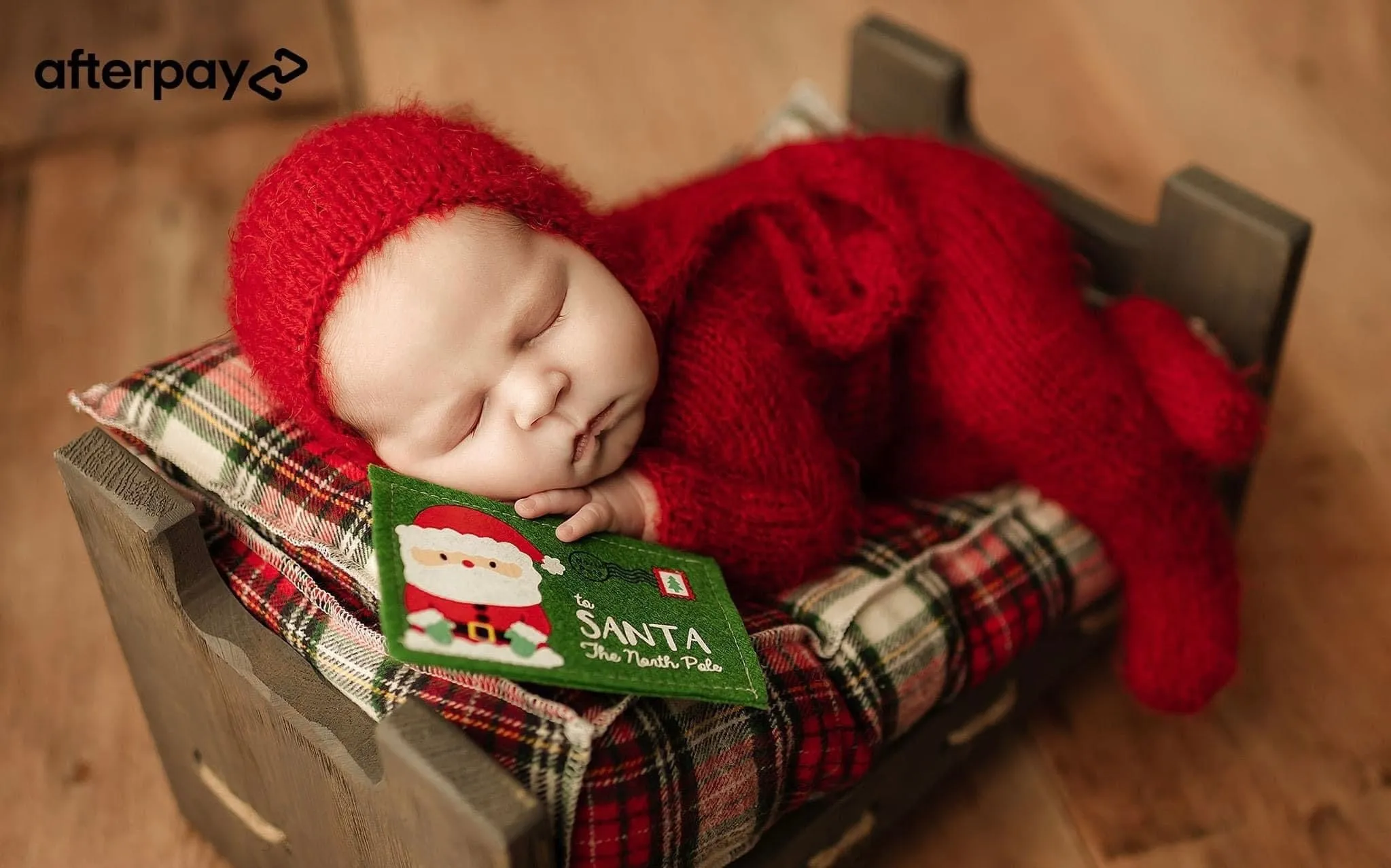Red Holiday footed Taran newborn romper with bonnet add-on